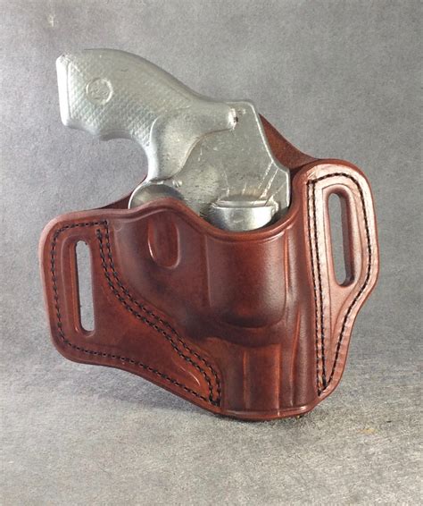 This holster is primarily made for a shoulder carry, but it can be used as an OWB holster as well by removing holster from harness. . Owb j frame holster